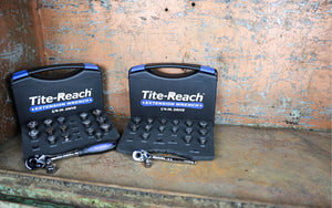 Two Tite-Reach socket sets on a rusty surface.